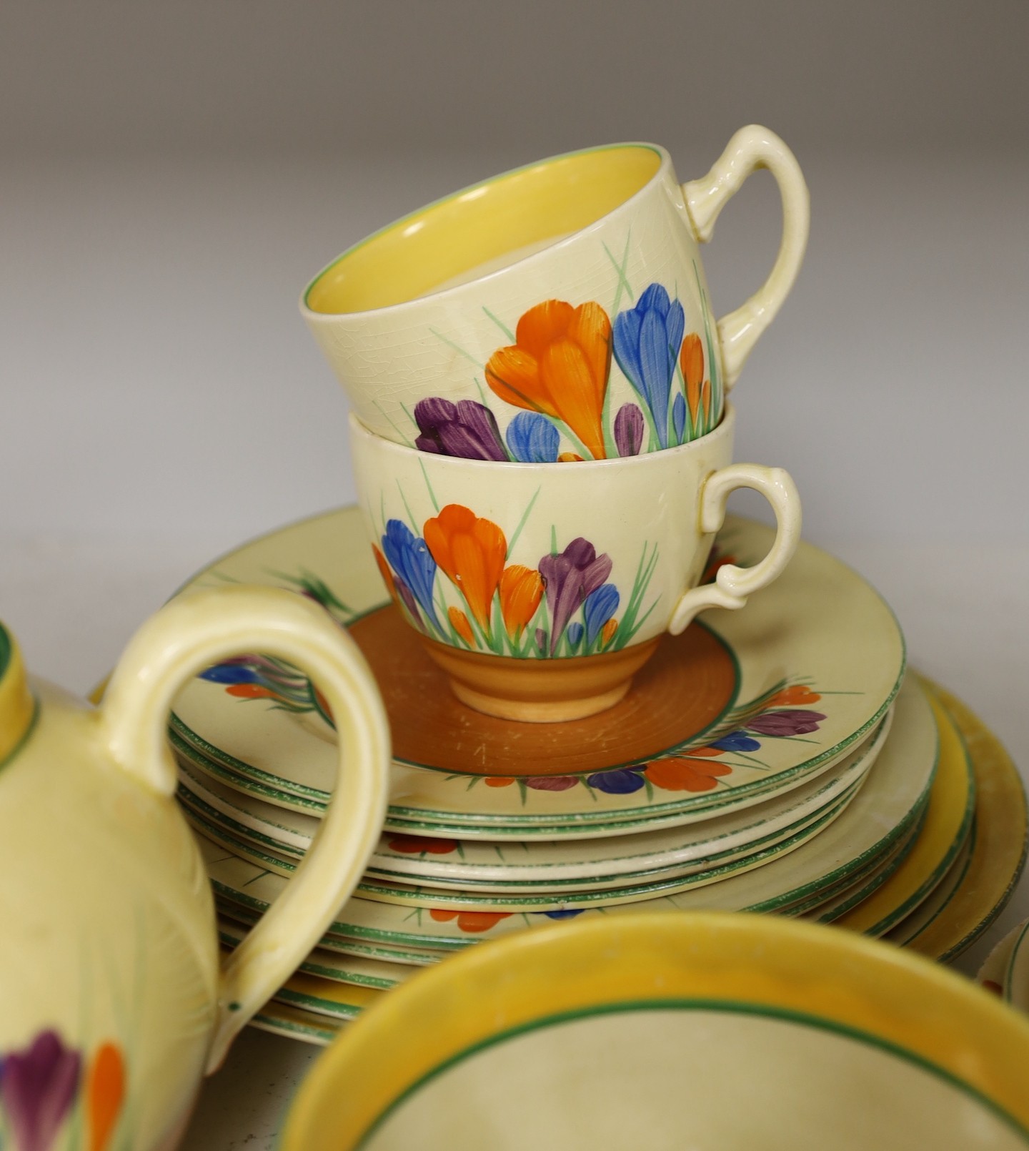 A group of Clarice Cliff crocus pattern tea wares, teapot 22 cm across